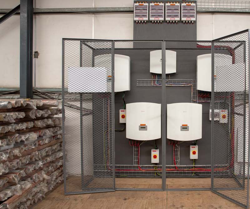 Commercial Solar Systems grid tied inverters in fenced off room